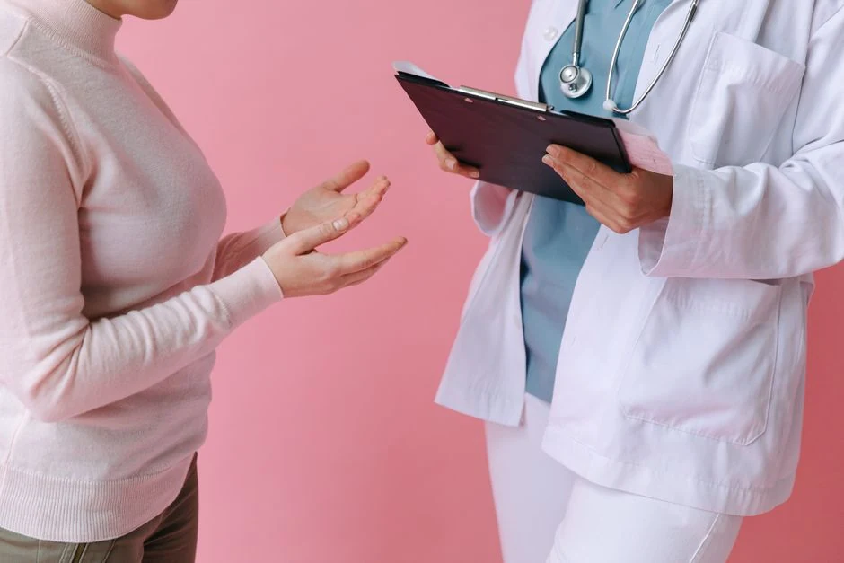 Doctor consulting with a patient in a medical office before an in-office procedure